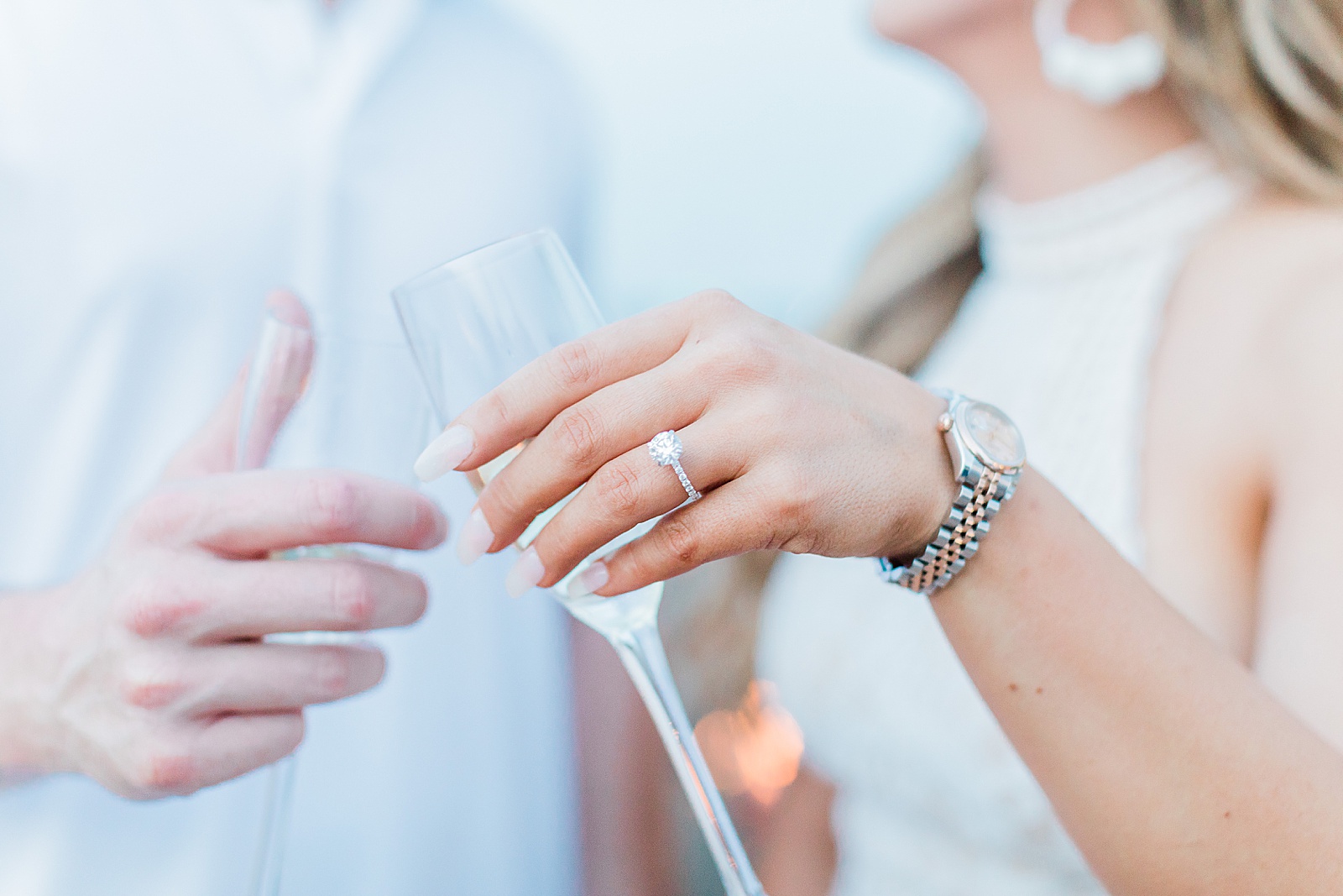 Champagne Glasses with Newly Engaged Couple