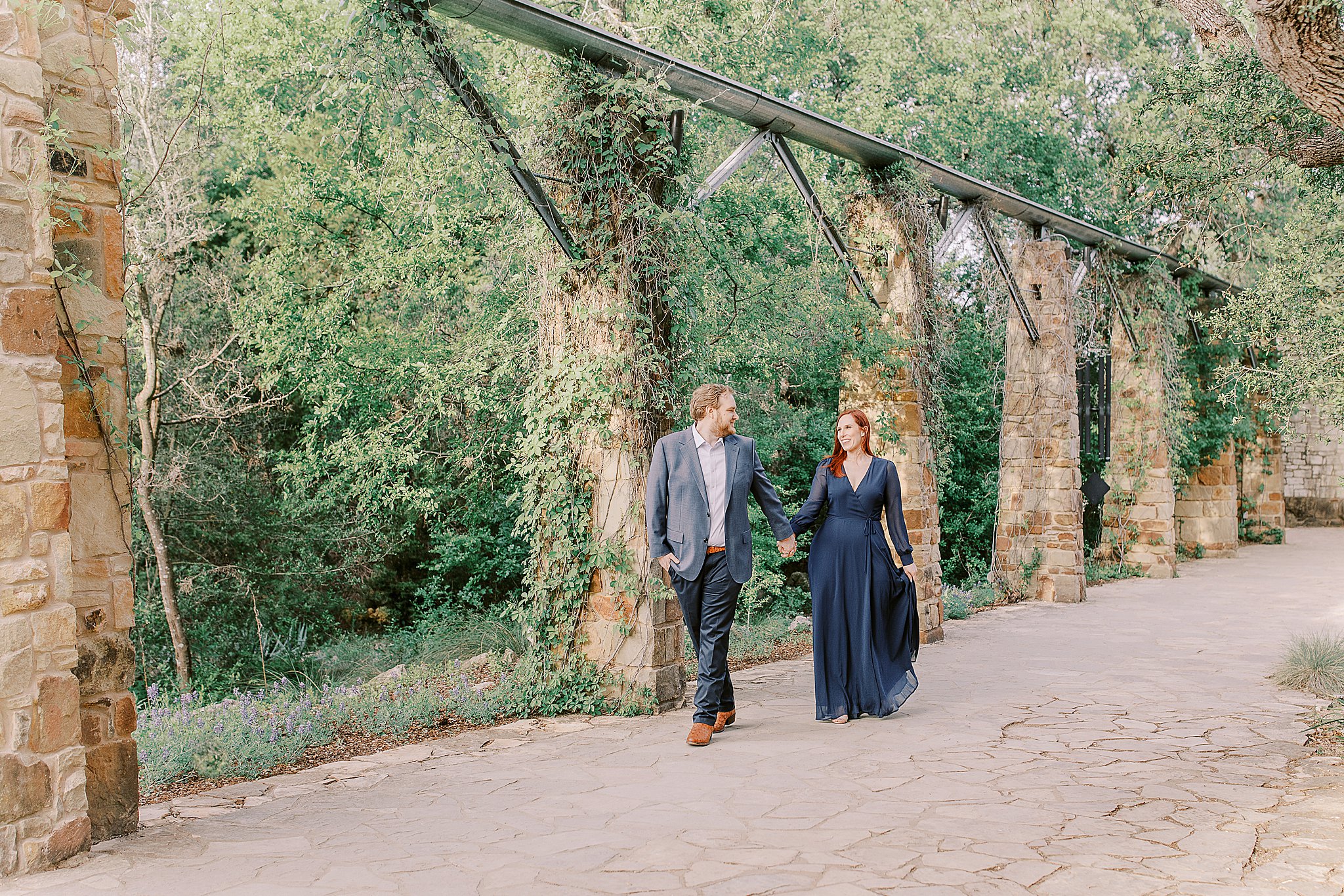 Navy Dress and Grey Suit at Engagement Session at Ladybird Johnson, Walking Couple Photos