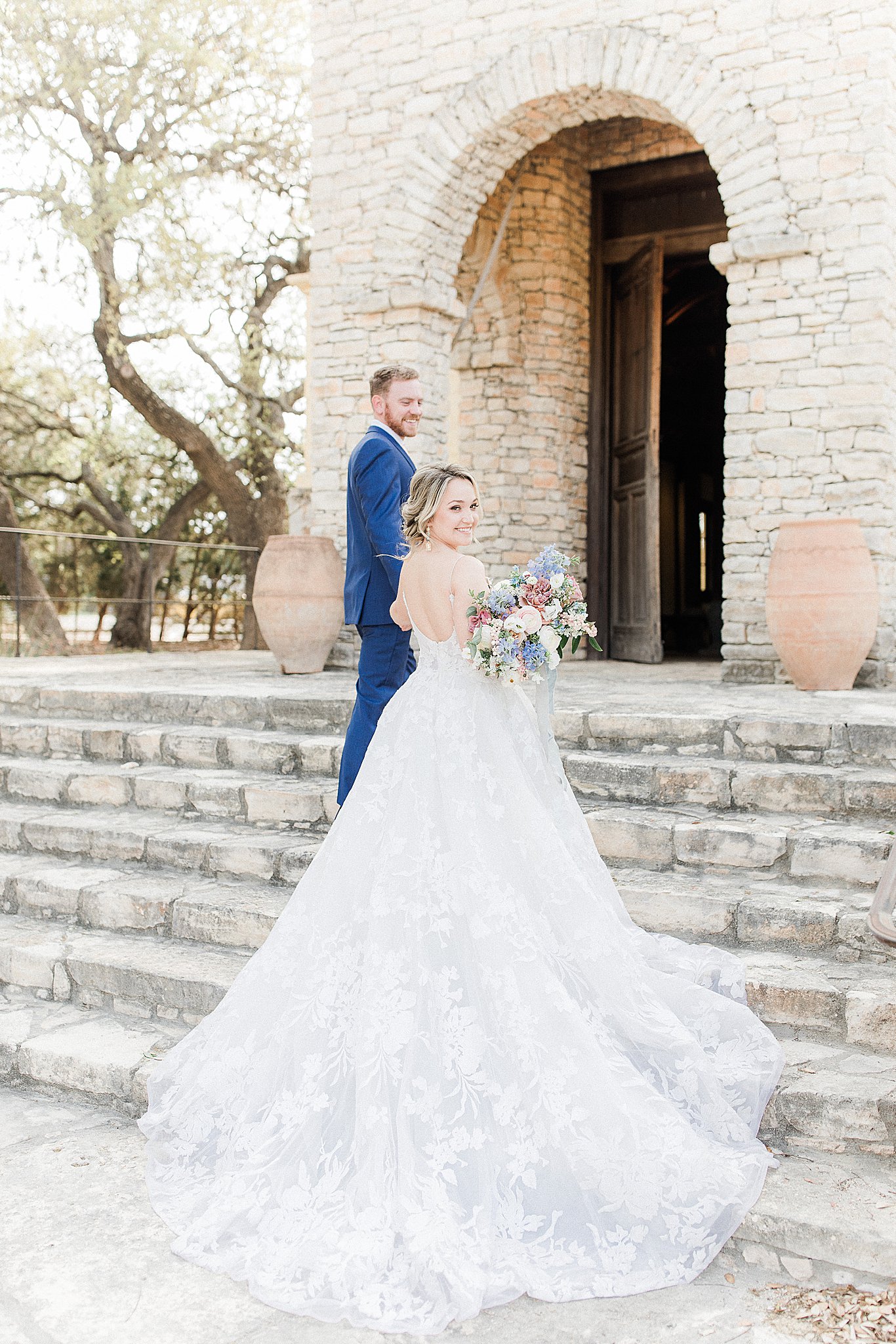Bride and Groom on steps of Ian's Chapel at Camp Lucy in Austin, Texas, Lace gown