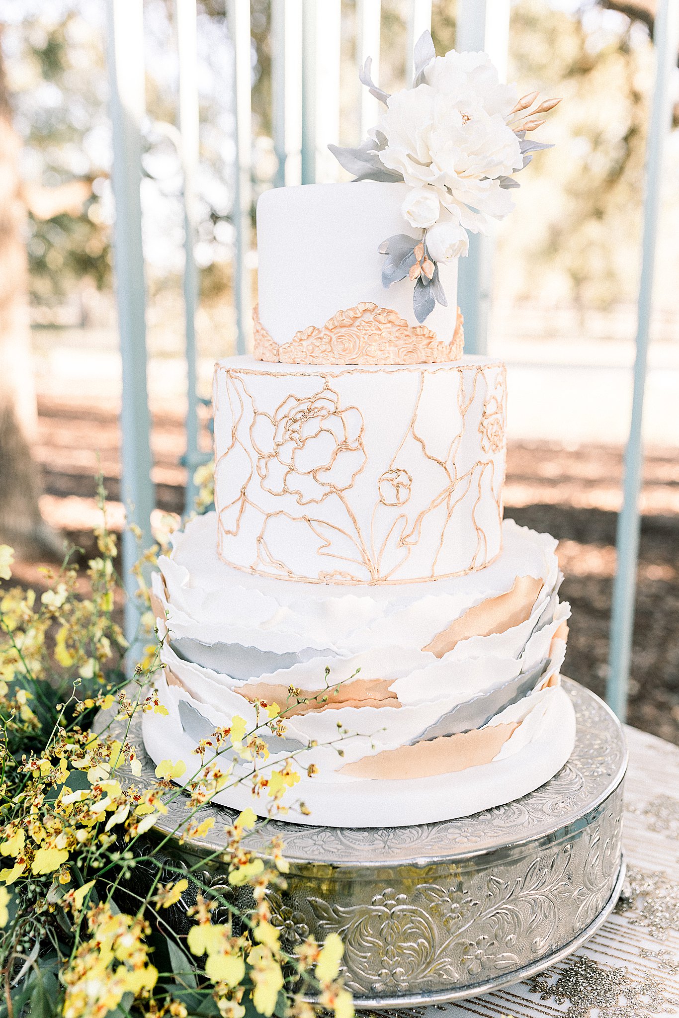 rose gold, silver, and white 3 tier modern cake in Dripping Springs, Texas