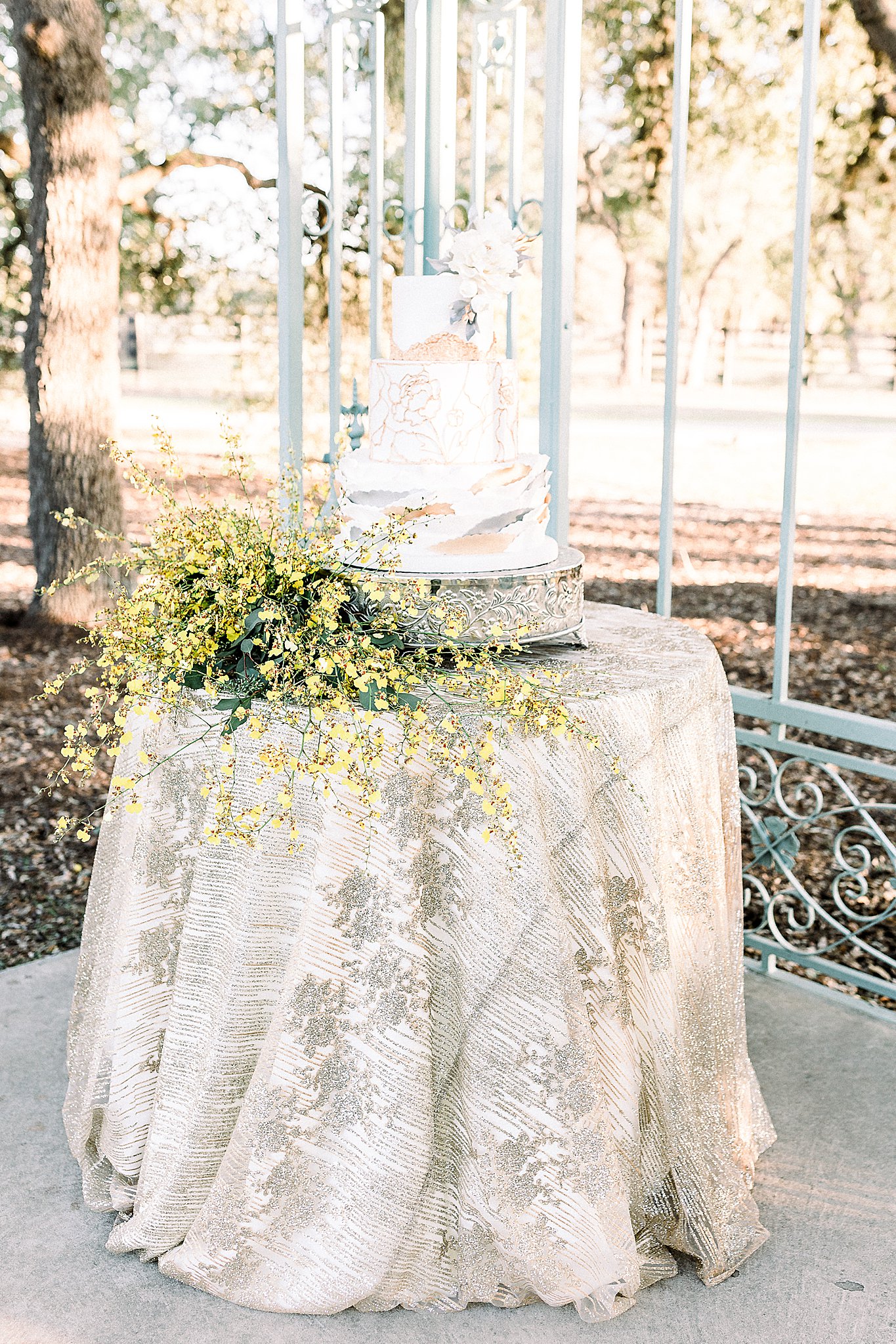 Cake table inspiration rose gold, silver, and yellow florals